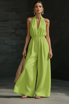 Fluorescent green halter-neck wide-leg jumpsuit with deep V neckline and cinched waist
