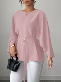 Blush pink belted batwing blouse with draped sleeves and square waist buckle