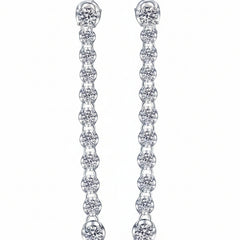 Silver drop earrings with round moissanite stones arranged vertically
