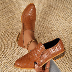 Point-toe block heel loafers in tan/brown with textured upper and gold chain detail.
