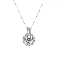 Sterling silver moissanite pendant necklace with round halo and prong-set center