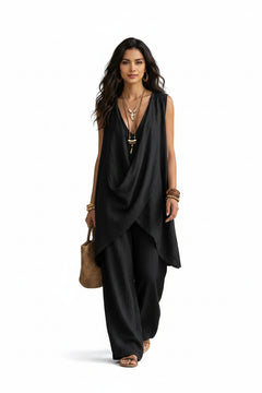 Sleeveless asymmetrical top and wide-leg pants set in black, draped crossover front