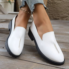 White round-toe block heel loafers with V-cut front and textured outsole