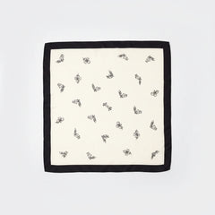 Lightweight silk scarf, off-white with black border and scattered printed motifs