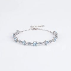 Sterling silver moissanite bracelet with light-blue stones and small chain extender
