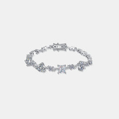 Sterling silver moissanite bracelet with rectangular clasp and zigzag prong-set stones