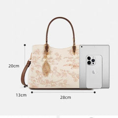 Ivory embroidered leather handbag, dimensions 28cm wide; 20cm high; 13cm deep