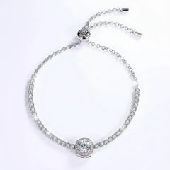 Silver tennis bracelet with round center stone and adjustable clasp, sparkling moissanite style