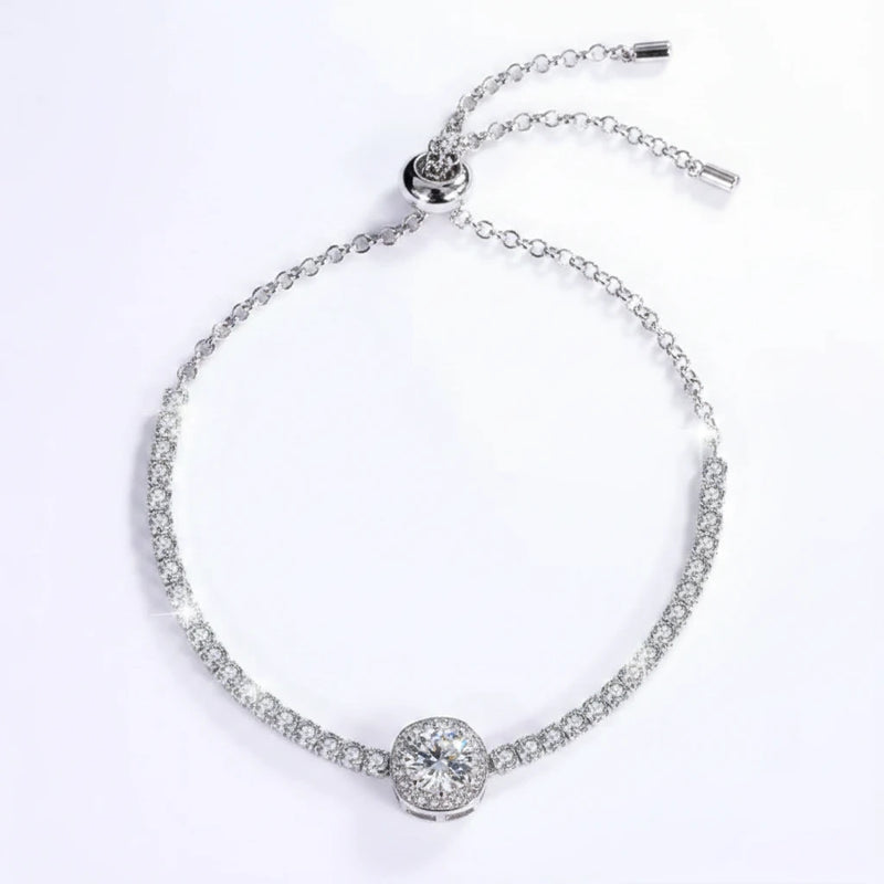 Silver tennis bracelet with round center stone and adjustable clasp, sparkling moissanite style