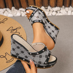 Peep toe wedge sandals with open toe and black-and-white patterned upper, side view