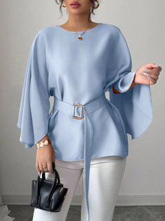 Light blue batwing sleeve belted blouse with square buckle at waist, flared hem