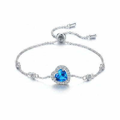 925 sterling silver bracelet with blue heart gemstone center and small round accents