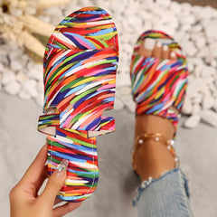 Striped open toe flat sandals with wide fabric straps and ankle strap