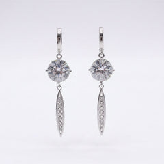 Silver moissanite drop earrings with round stones, oval pavé drops, and small hoops