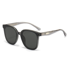 Oversized square sunglasses with dark frames, dark lenses, and silver temple arms