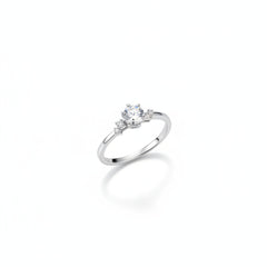 Sterling silver solitaire ring with round moissanite center and clustered pavé shoulders