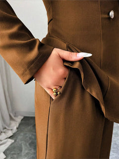 Brown one-button blazer and wide-leg pants set, close-up of waist detail