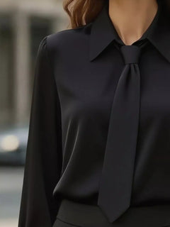 Black collared long-sleeve blouse with neck tie and relaxed fit