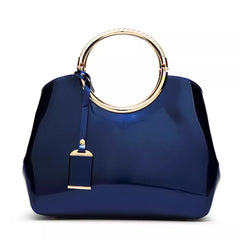 Indigo glossy handbag with round ring handle and gold keychain charm