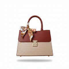 Top-handle handbag with burgundy top, beige crocodile-embossed body, gold clasp, scarf bow