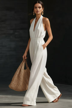 White halter-neck wide-leg jumpsuit with V-front and flowing wide pant legs