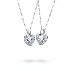 Heart-shaped moissanite pendant necklaces in sterling silver with two matching heart stones