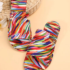 Colorful striped open toe flat sandals with bow-style toe strap and low sole