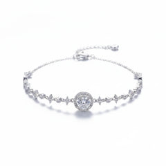 Sterling silver tennis bracelet with round center halo and charm-like pavé sections