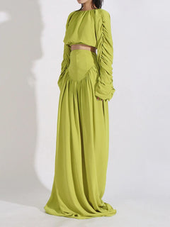 Green ruched long-sleeve crop top and high-waist maxi skirt set, gathered sleeve cuffs