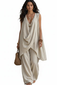 Sleeveless asymmetrical top and wide-leg pants set in off-white, draped crossover front