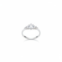 Sterling silver moissanite three-stone ring angled view, round center stone with side stones