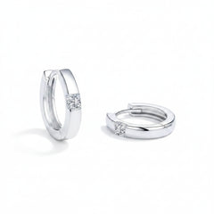 Sterling silver moissanite huggie earrings, side angle showing hoop backs