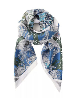 Blue silk scarf with botanical floral print in white, green, and light blue