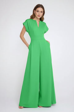 Neon green plus size jumpsuit with notched V-neck and wide-leg flares, short sleeves.