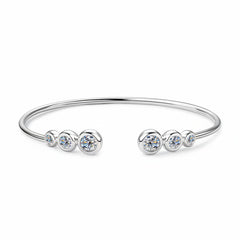Silver-tone bracelet with five round clear stones across open cuff