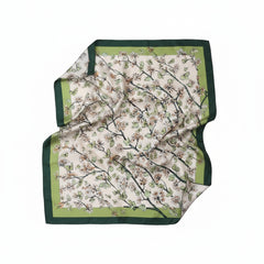 Silk scarf with floral branch print and dark green border, folded drape