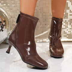 Round-toe kitten-heel ankle boot in dark brown patent leather finish