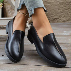 Black round-toe block heel loafers with V-cut front and textured outsole