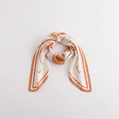 Square flower silk scarf in sherbet orange and white with graphic floral design