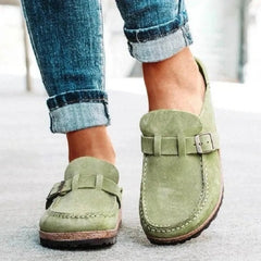Sage green suede round-toe low-heel loafers with front buckle strap and stitched trim