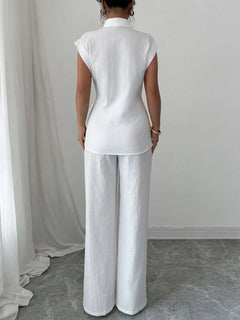 Off-white back view of collared cap-sleeve peplum top and wide-leg pants
