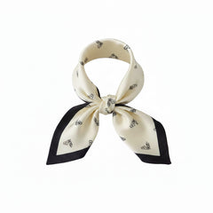 Lightweight silk scarf, off-white with black corner accents and knot-tied bow