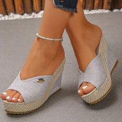 Peep-toe wedge sandals with light fabric uppers and braided platform wedge heels