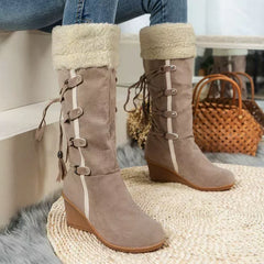 Taupe wedge boots with faux-shearling cuff, side lace ties, and adjustable buckles