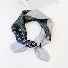 Printed silk square scarf in dark navy with light gray speckled paisley accents