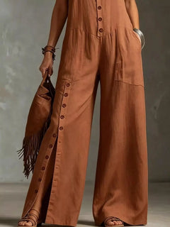Rust-brown wide-leg jumpsuit with front buttons and patch pockets