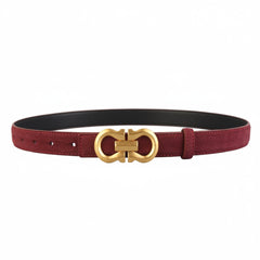 Red leather-look belt with gold-tone oval buckle and center bar