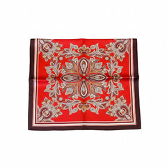 Deep red silk scarf with ornate paisley floral medallion in the center and dark trim