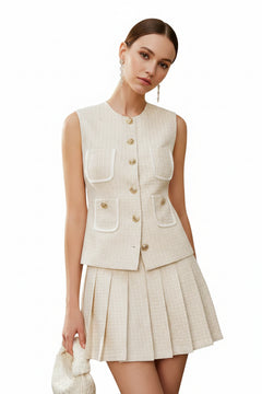 Beige tweed button-front vest with patch pockets and pleated mini skirt, sleeveless
