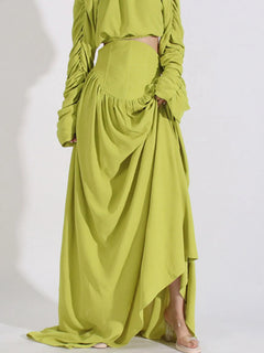 Green high-waist maxi skirt with draped layers and ruched waistband, long sleeves